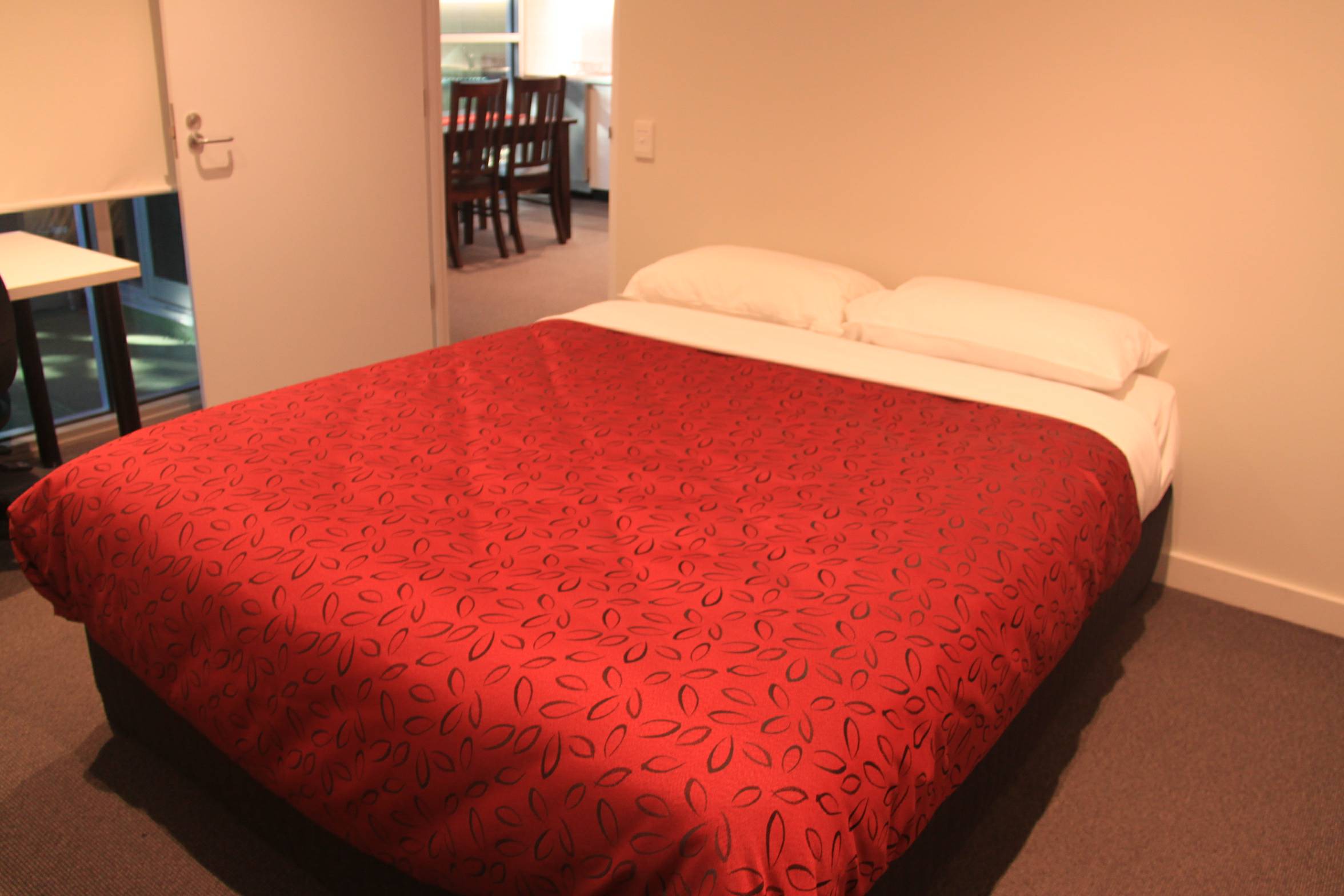 New College guest Apartment Bedroom w lounge room background